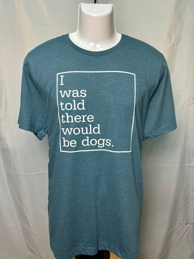 front of a blue t-shirt that says "I was told there would be dogs" in white writing