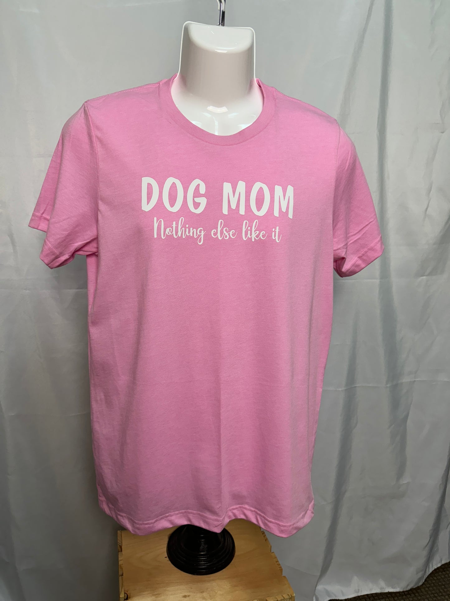 Pink T-shirt with the phrase "Dog Mom Nothing Else Like It" written in white