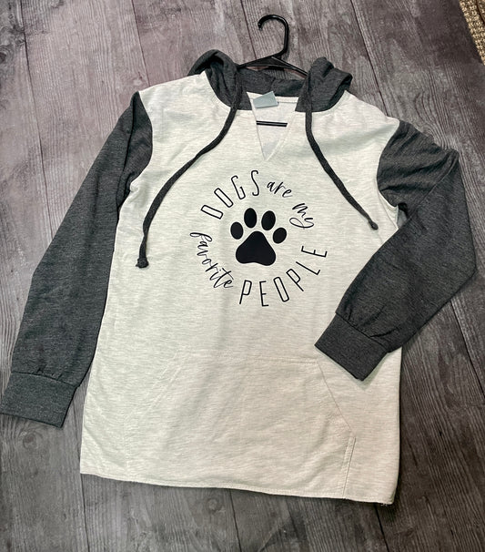 A oatmeal colored hoodie with contrasting grey sleeves with a design in the middle that reads "Dogs are my favorite people"