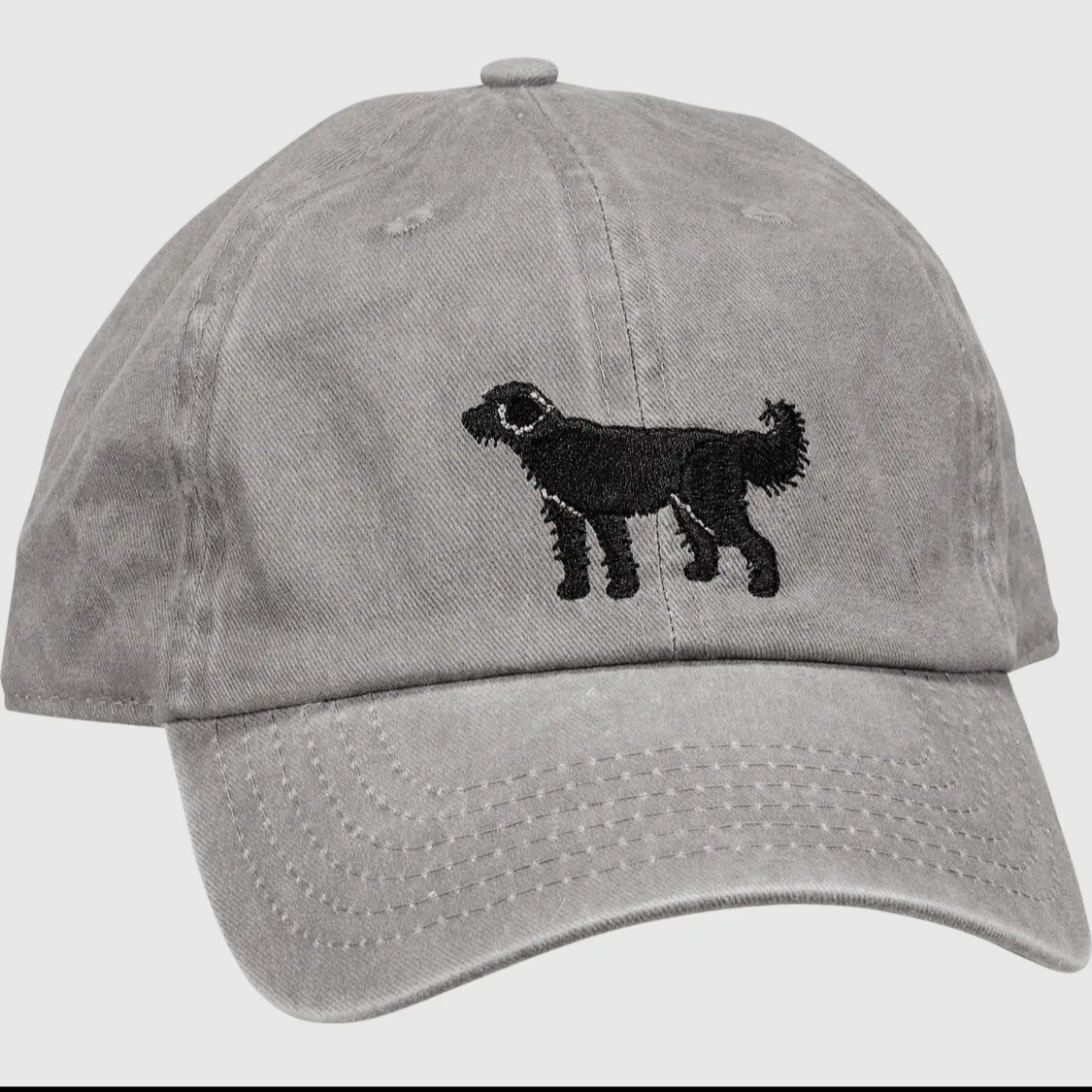 a grey baseball cap with the outline of a Doodle