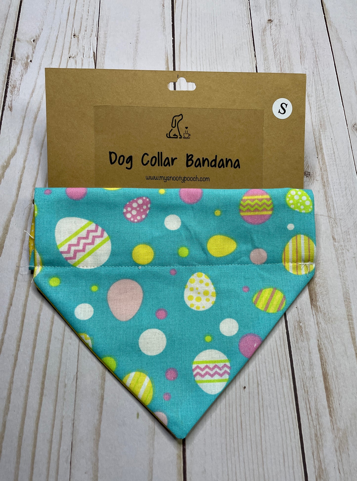 An easter dog bandanna with colorful eggs on a blue background 