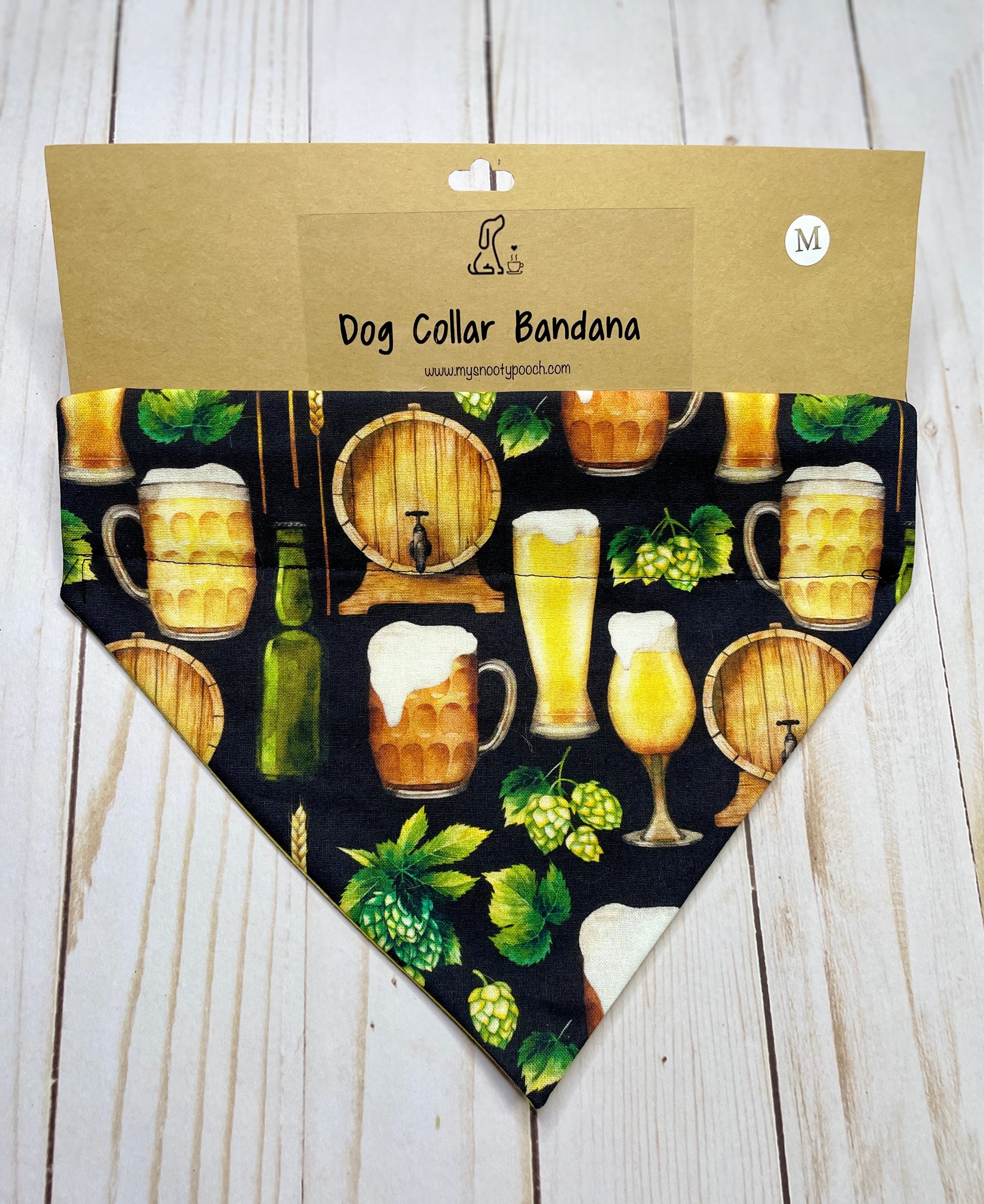 a dog bandanna with a black background with a beer keg, beer glasses, and hops