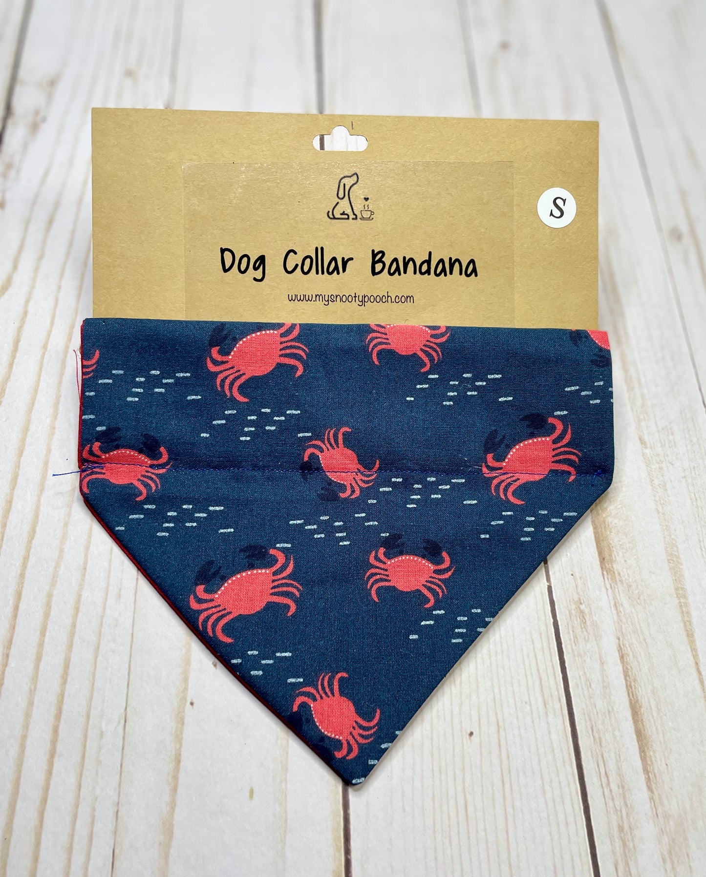 dog bandanna with red crabs on a navy background
